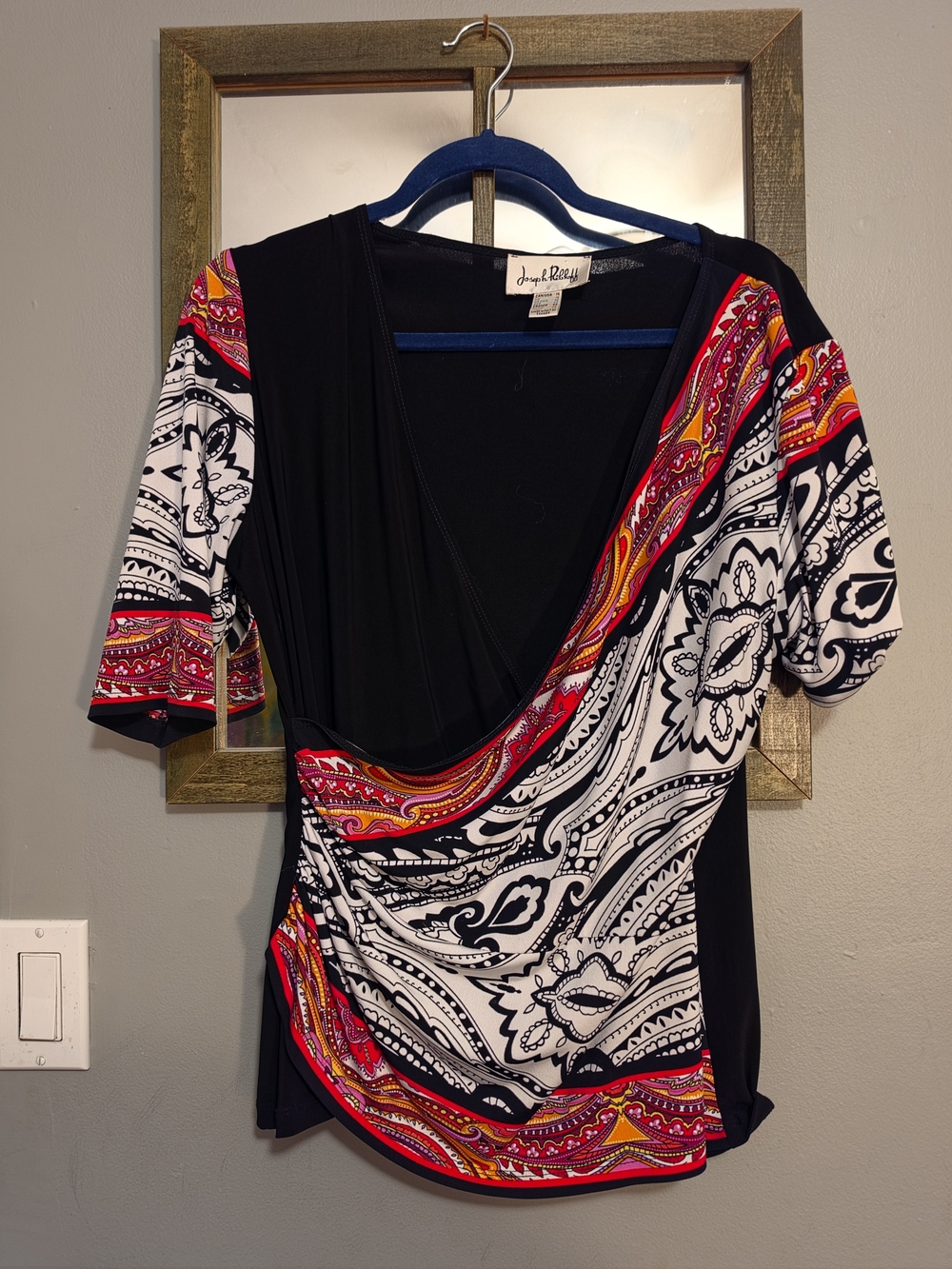 Joseph Ribkoff Black Wrap-Style Top with Red-Pink-Orange Paisley Accents